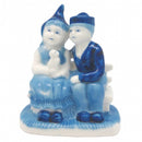 Blue & White Figurine: Dutch Couple Sitting on Bench - GermanGiftOutlet.com
 - 1